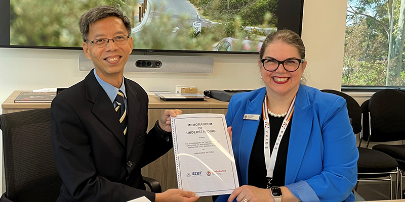 SCDF Director of Emergency Medical Services Department Senior Assistant Commissioner Yong Meng Wah and 51 Chief Executive Jane Miller holding the Memorandum of Understanding document.